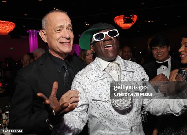 Tom Hanks and Flavor Flav attend the Pre-GRAMMY Gala & GRAMMY Salute to Industry Icons Honoring Jon Platt at The Beverly Hilton on February 03, 2024...