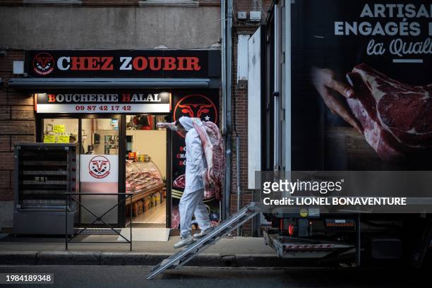 Man delivers meat for a halal butcher's shop on February 7, 2024 in Toulouse, southwestern France.