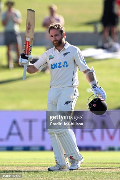 Kane Williamson of New Zealand raises his bat after scoring a century during day one of the First Test in the series between New Zealand and South...