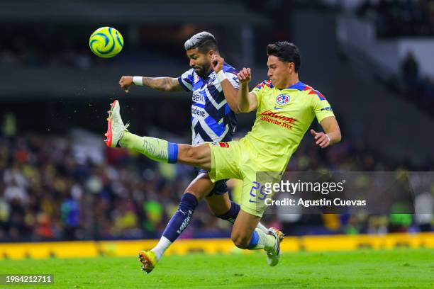 Rodrigo Aguirre of Monterrey fights for the ball with Ramon Juarez of America during the 5th round match between America and Monterrey as part of the...