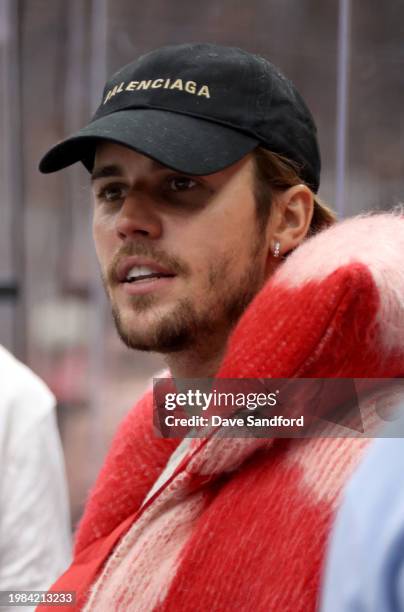 Justin Bieber looks on from the bench area of Team Matthews during their game against Team Hughes at the 2024 Honda NHL All-Star Game at Scotiabank...