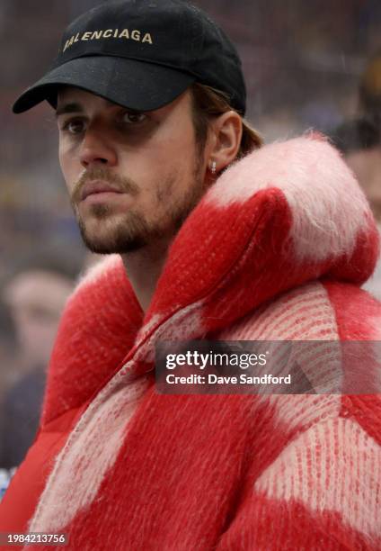 Justin Bieber looks on from the bench area of Team Matthews during their game against Team Hughes at the 2024 Honda NHL All-Star Game at Scotiabank...