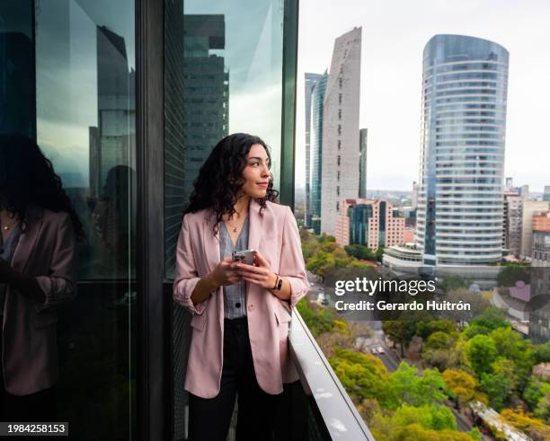 business woman using cellphone in mexico city - capital stock pictures, royalty-free photos & images
