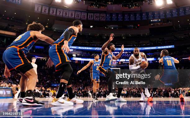 LeBron James of the Los Angeles Lakers drives against the New York Knicks during their game at Madison Square Garden on February 03, 2024 in New York...