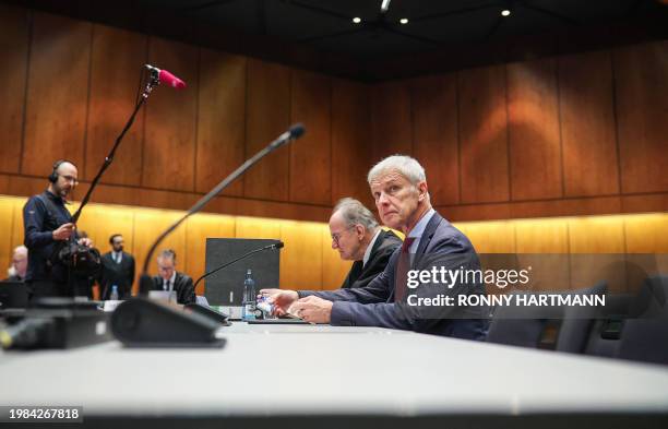 Former CEO of German carmaker Volkswagen Matthias Mueller and and his lawyer Eberhard Kempf wait for the begin of the model case proceedings in...