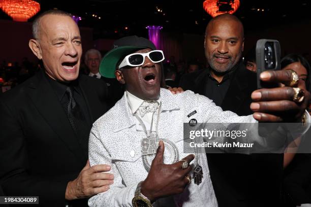 Tom Hanks, Flavor Flav and guest attend the Pre-GRAMMY Gala & GRAMMY Salute to Industry Icons Honoring Jon Platt at The Beverly Hilton on February...