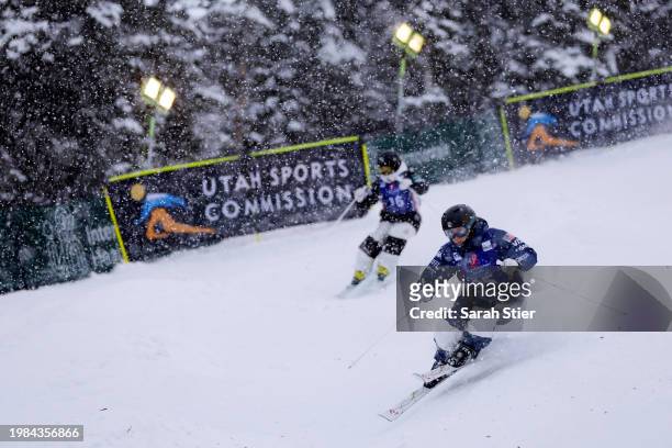 Kasey Hogg of Team United States competes against Yumi Taguchi of Team Japan during the preliminary rounds of the Women's Dual Moguls Competition at...