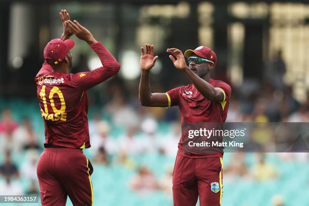 Justin Greaves of the West Indies celebrates with team mates after taking a catch to dismiss Will Sutherland of Australia during game two of the...