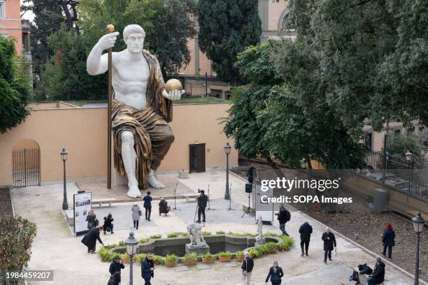 People attend the press preview of the reconstructed monumental statue depicting Roman emperor Constantine the Great , the 'Colossus of Constantine'...