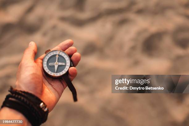 Guy Using A Compass 1,759 Person Holding Compass Stock Photos, High-Res Pictures, and ...