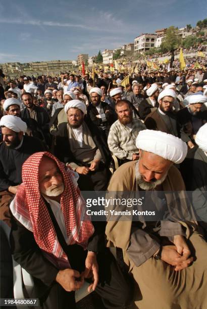 Tens of thousands of people who gathered in a stadium to celebrate the departure of Israeli troops from southern Lebanon, listen to Sheikh Nasrallah,...