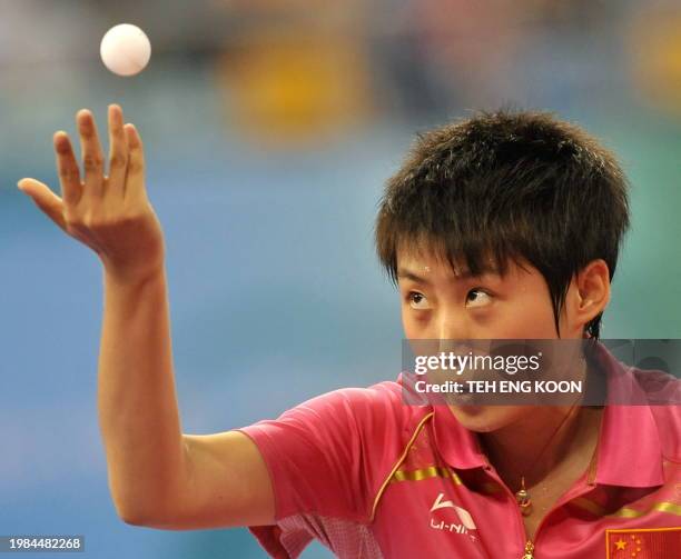 China's table tennis player Guo Yue serves against Dominican's Wu Xue during the Women's Team table tennis qualification round of the 2008 Beijing...