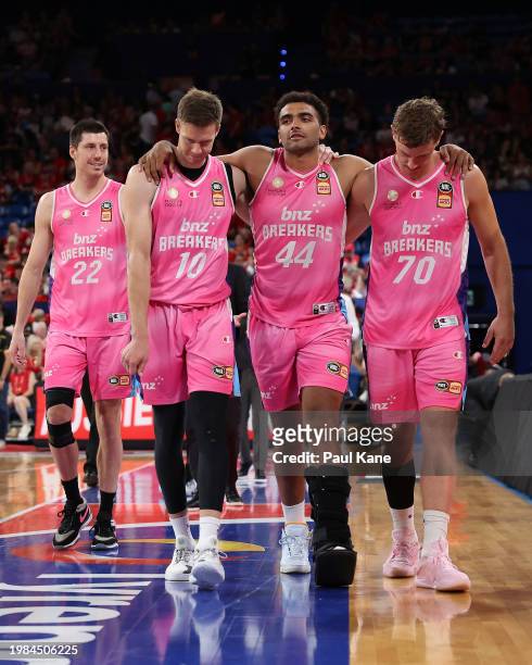 Anthony Lamb of the Breakers is assisted from the court by Tom Abercrombie and Finn Delany of the Breakers after winning the round 18 NBL match...