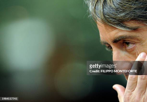 Inter-Milan trainer Roberto Mancini touches his eye during the press conference prior to his team's training session at Anfield Stadium on Febuary...