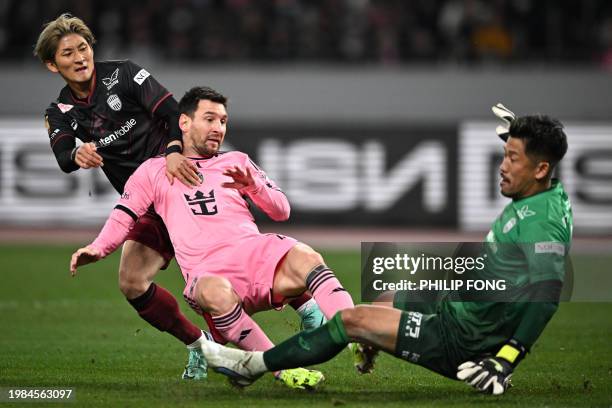 Inter Miami's Argentine forward Lionel Messi clashes with Vissel Kobe's goalkeeper Shota Arai during the second half of the friendly football match...