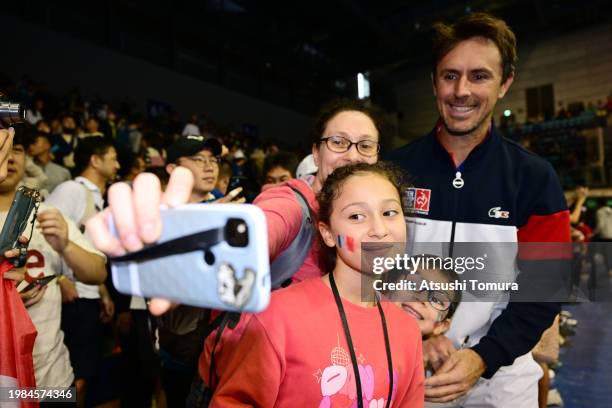 Edouard Roger-Vasselin of France takes a selfie with fans during day 2 of the Davis Cup Qualifier match the Davis Cup Qualifier match between Chinese...