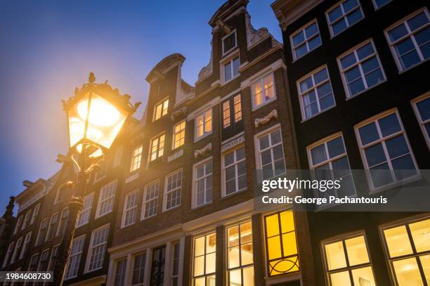 street lamp and architecture in holland - amsterdam sunrise stock pictures, royalty-free photos & images