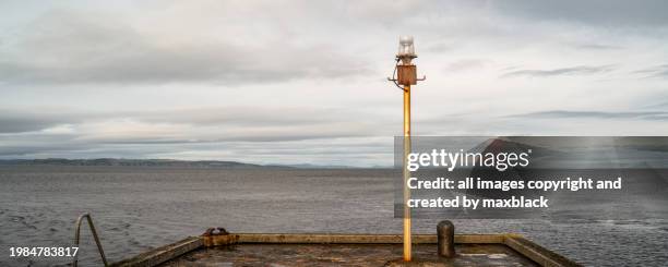 harbour light-river nairn-scotland. - moray scotland stock pictures, royalty-free photos & images