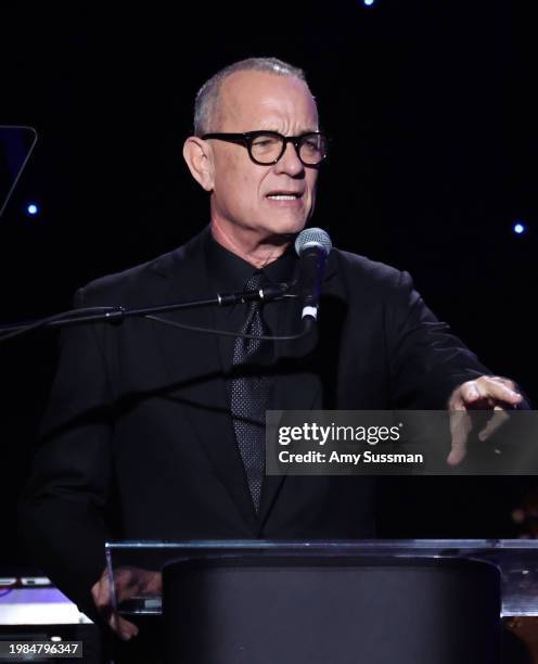 Tom Hanks speaks onstage during the 66th GRAMMY Awards Pre-GRAMMY Gala & GRAMMY Salute to Industry Icons Honoring Jon Platt at The Beverly Hilton on...