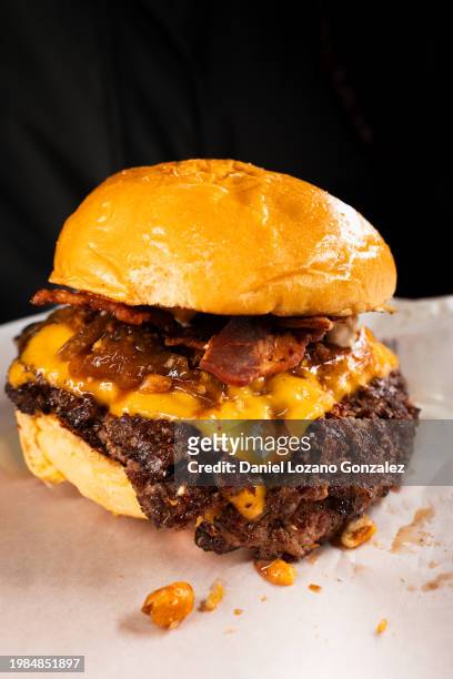 tasty smash burger with cheese melted on ready to eat - changing form stock pictures, royalty-free photos & images