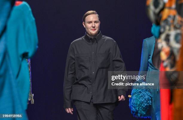 February 2024, Berlin: Designer Danny Reinke takes to the catwalk after his show in the Verti Music Hall. Photo: Jens Kalaene/dpa