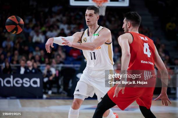 Mario Hezonja of Real Madrid and Erico Vila of Basquet Girona in action during Liga Endesa match between Real Madrid and Basquet Girona at WiZink...