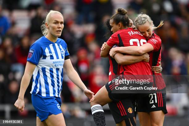 Nikita Parris of Manchester United celebrates celebrates scoring her team's first goal with teammates Geyse and Millie Turner during the Barclays...