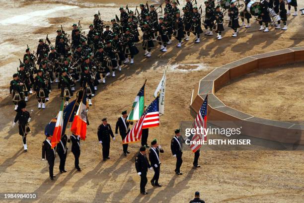 Bagpipers arrive at the pit of Ground Zero in New York 11 September on the first anniversary of the attacks that leveled the World Trade Center....