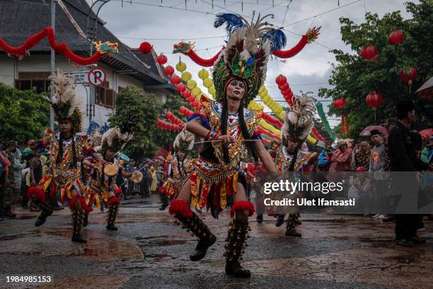 Participants perform during the Grebeg Sudiro festival as part of the Lunar New Year celebrations on February 4, 2024 in Solo City, Indonesia. The...