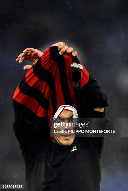 Milan's Filippo Inzaghi takes off his jersey at the end of his team's Serie A football match against SS Lazio in Rome's Olympic Stadium on November...