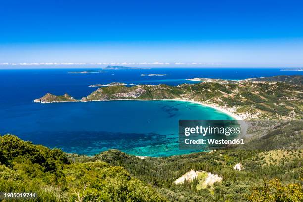greece, ionian islands, agios georgios, blue bay of corfu island in summer - ionian sea stock pictures, royalty-free photos & images
