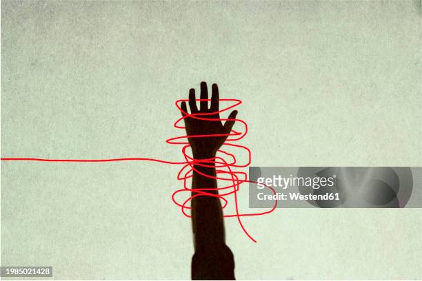 illustrazioni stock, clip art, cartoni animati e icone di tendenza di human hand trapped in red tangled strings - photo manipulation