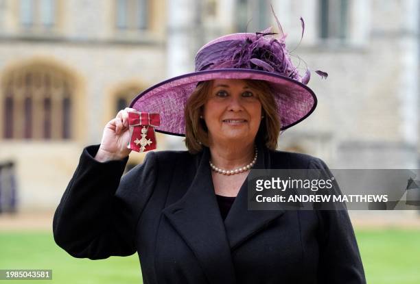 Chief Executive Little Hearts Matter Suzanne Hutchinson poses with their medal after being appointed a Member of the Order of the British Empire...