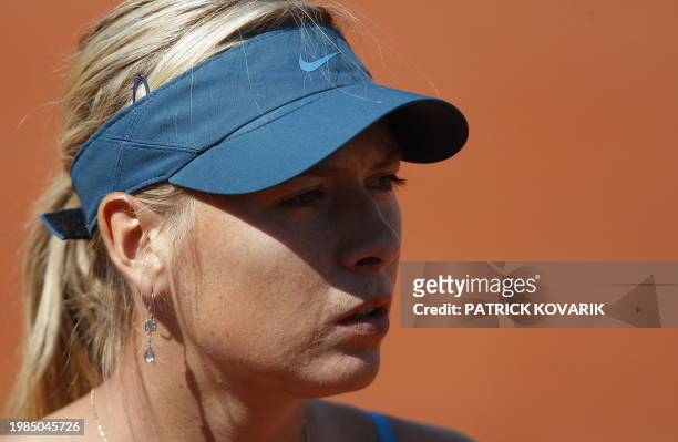 Russia's Maria Sharapova reacts to play against Slovakia's Dominika Cibulkova during a French Open tennis quarter final match on June 2, 2009 at...
