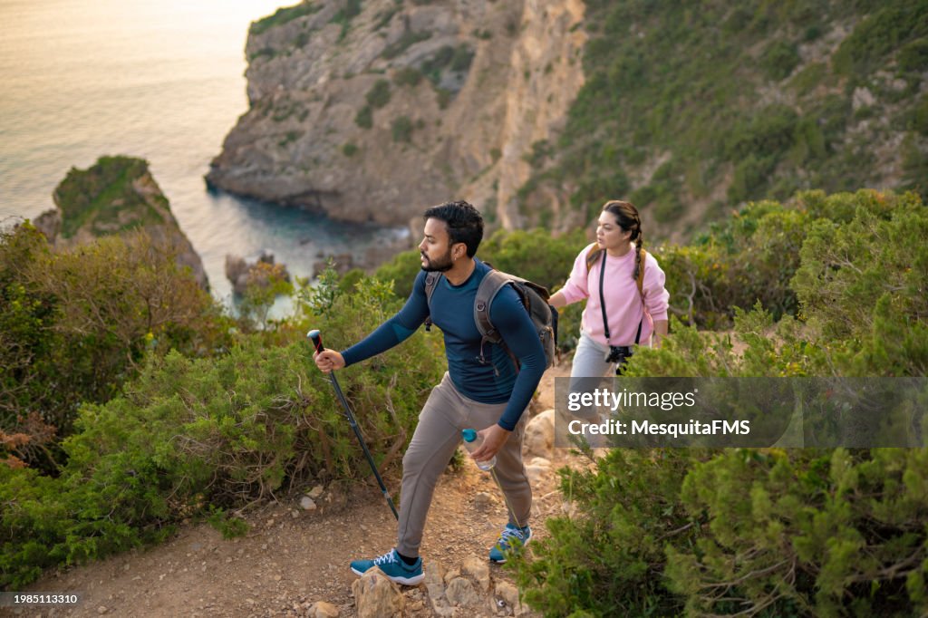 Tourists hiking on the beach