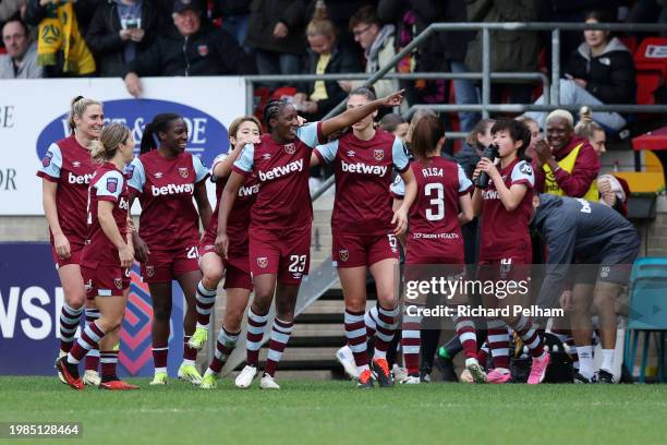 Hawa Cissoko of West Ham United celebrates with teammates after scoring her team's second goal during the Barclays Women's Super League match between...