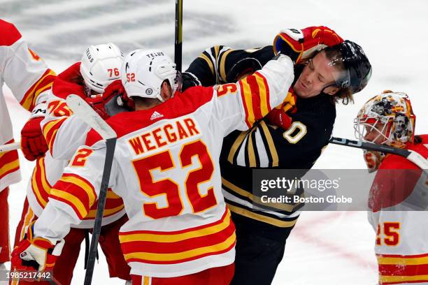 Boston, MA Boston Bruins C Jesper Boqvist is shoved in the face by Calgary Flames D MacKenzie Weegar in the first period. The Bruins lost to the...