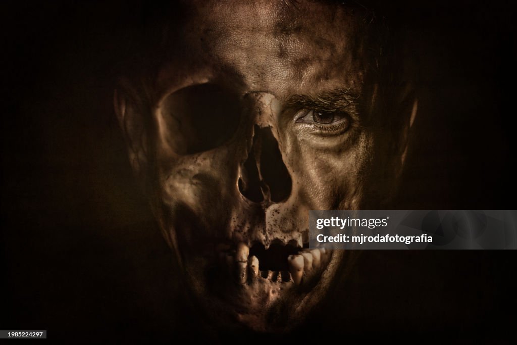 Portrait of a man's face merging with a skull representing life and death