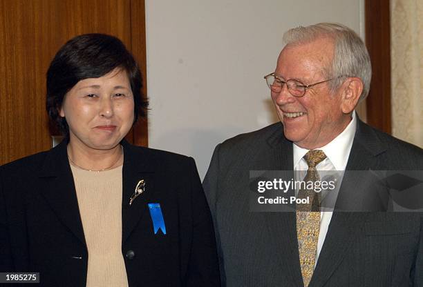 Ambassador to Japan Howard Baker smiles with Japanese abductee Hitomi Soga while at the U.S. Embassy May 9, 2003 in Tokyo, Japan. Soga was one of...