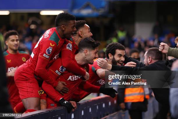 Matheus Cunha of Wolverhampton Wanderers celebrates with teammates and fans scoring his team's third goal during the Premier League match between...