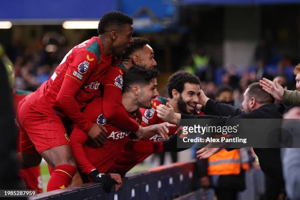 Matheus Cunha of Wolverhampton Wanderers celebrates with teammates and fans scoring his team's third goal during the Premier League match between...