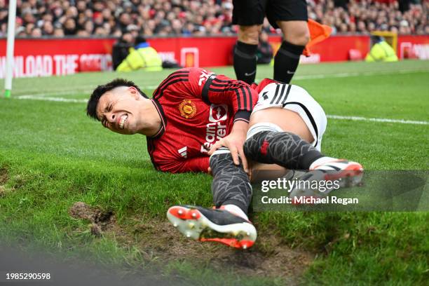 Lisandro Martinez of Manchester United goes down with an injury during the Premier League match between Manchester United and West Ham United at Old...