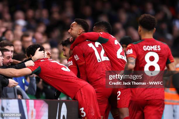 Matheus Cunha of Wolverhampton Wanderers celebrates with teammates and fans scoring his team's third goal during the Premier League match between...