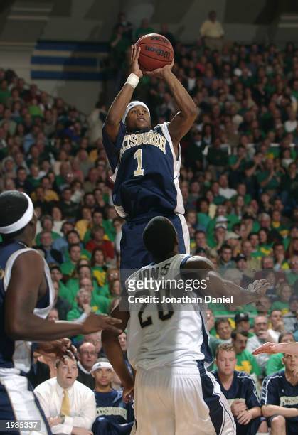 Julius Page of Pittsburgh takes a jump shot over Torrian Jones of Notre Dame during the game at Joyce Center at the University of Notre Dame on...