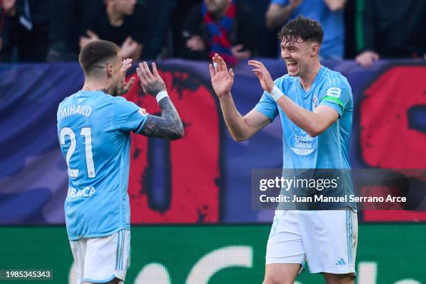 Jorgen Strand Larsen of RC Celta Vigo celebrates with his teammate Mihailo Ristic of RC Celta Vigo after scoring the first goal during the LaLiga EA...