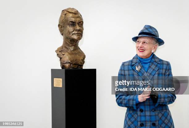 Queen Margrethe reacts after unveiling a bust of her husband Prince Henrik created by Faroese artist and sculptor Hans Pauli Olsen as she attends the...