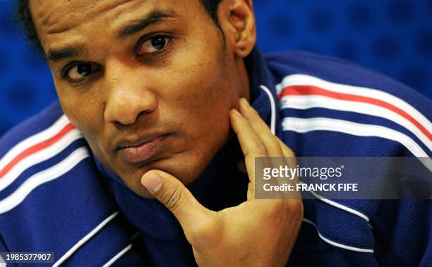 French football national team midfielder Florent Malouda answers journalists questions on November 15 at the hotel in London Colney, north London,...