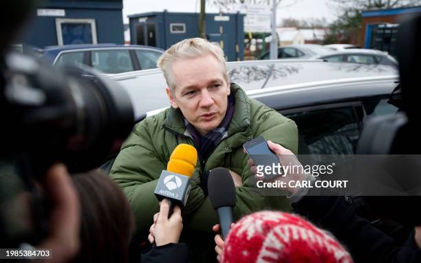 WikiLeaks founder Julian Assange speaks to journalists outside Diss train station in Norfolk on December 18, 2010. Assange said on December 17 it was...