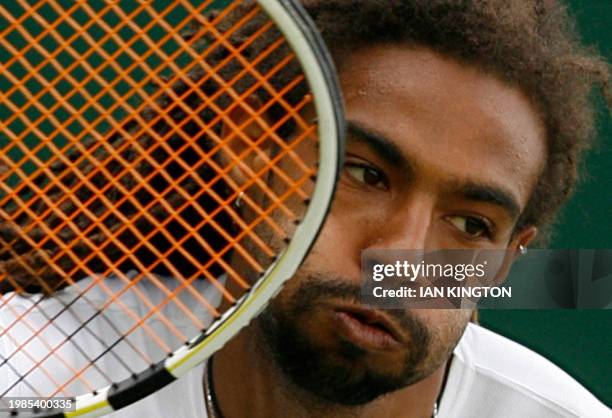 Jamaica's Dustin Brown returns a ball to Austrian player Jurgen Melzer during the Wimbledon Tennis Championships at the All England Tennis Club, in...