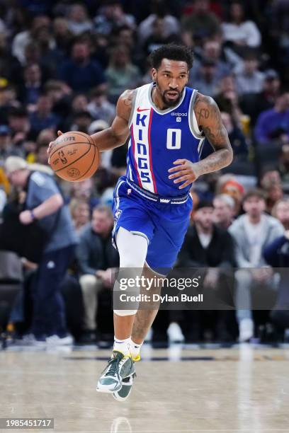 Malik Monk of the Sacramento Kings dribbles the ball in the second quarter against the Indiana Pacers at Gainbridge Fieldhouse on February 02, 2024...